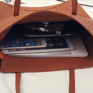 the content of a big shoulder bag - IPad + Iphone + Macbook