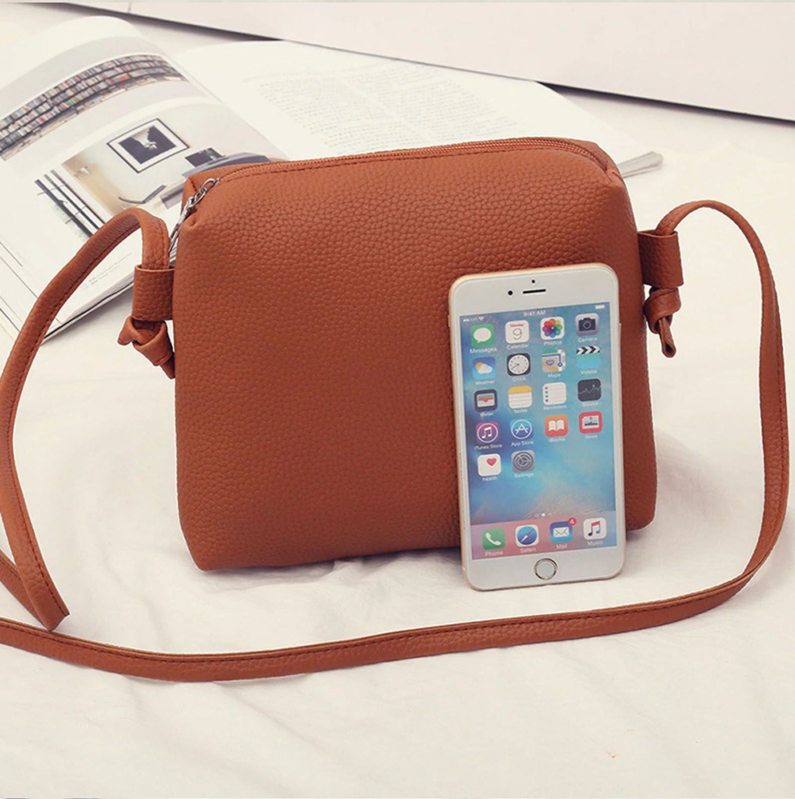 mid Shoulder bag and an IPhone comparision