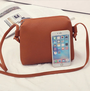 mid Shoulder bag and an IPhone comparision